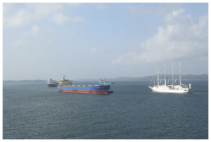 Ships assembling to enter Gatun northbound, Z12 and "Wind Spirit" readying to cross Gatun Lake.