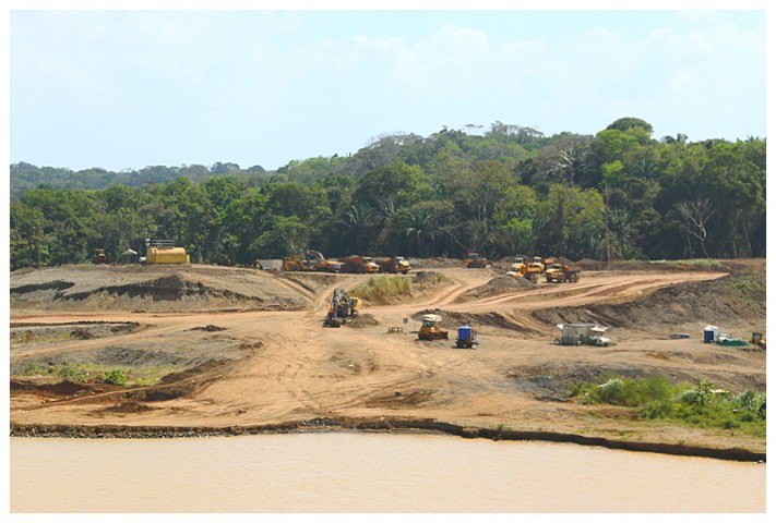 Bulldozers moving the dried dredge mud.