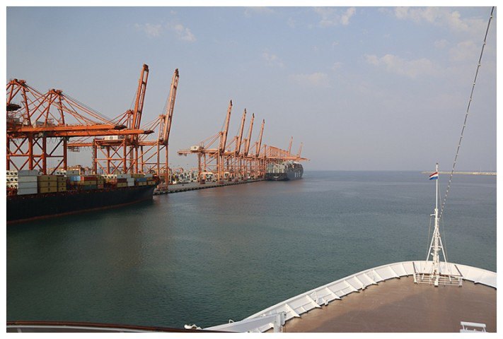 Having swung, the container berths to port