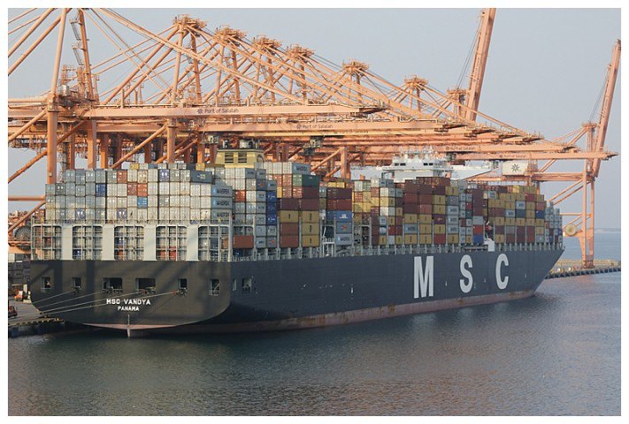 A massive container ship, capable of carrying approximately 13,000 boxes