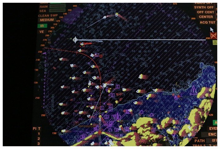Our radar. We are up at 10 o'clock, (white line); some ships at anchor and others approaching or leaving.