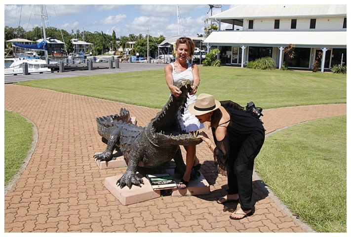 The girls found a crocodile to bother....