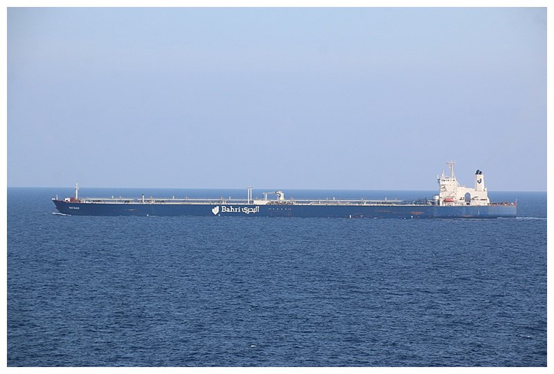 WE pass a VLCC, (very Large Crude Carrier, laden with oil. The "Watban" is 300, 360 tons, 340m long and 56m wide