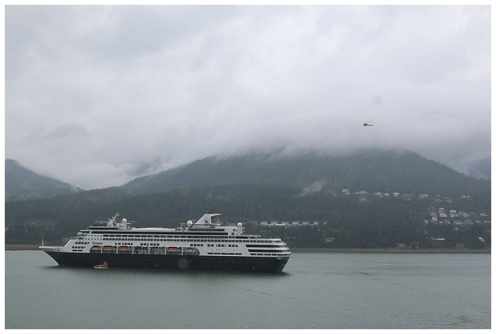 The 'Statendam', anchored in Juneau, conducting helicopter operations; landing a new Ku antenna on the top deck