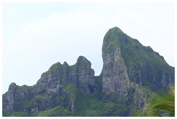 Towering above us, the volcanic peaks of the island