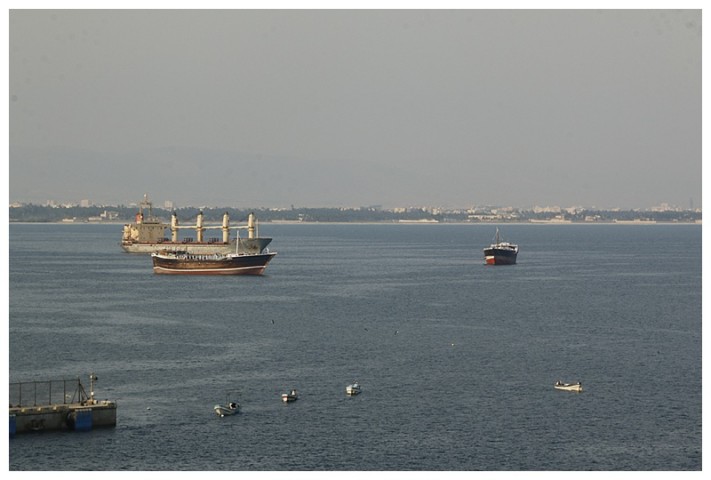 Fishermen and ships at anchor