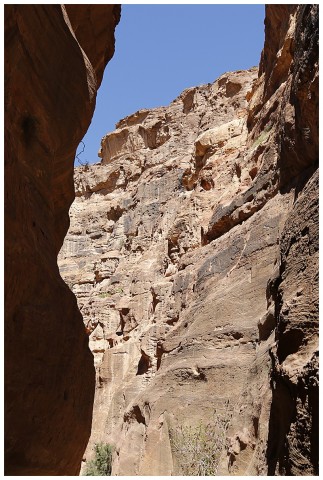 With towering cliffs, either side