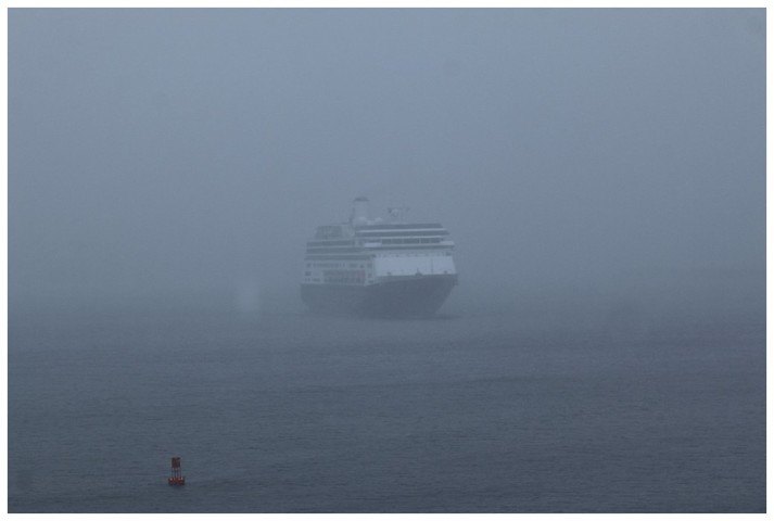 The Zaandam approaching her berth as she comes through the wind and rain
