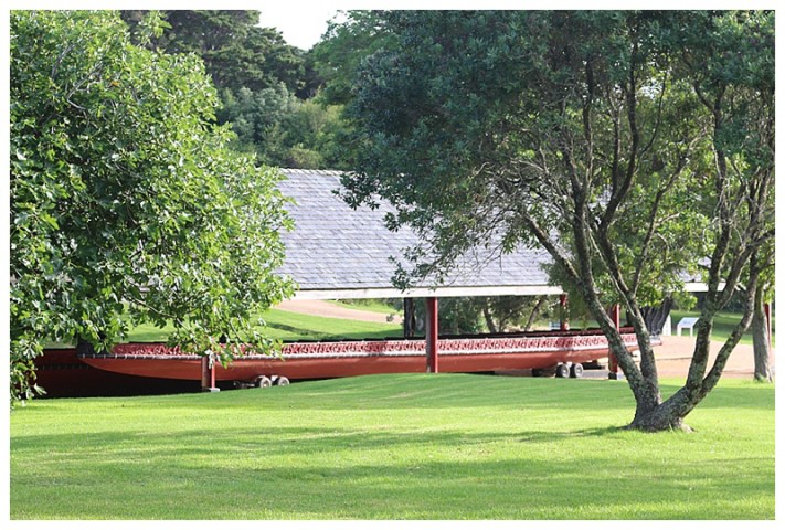 A Maori war-canoe, used in the ceremony, lies under shelter until the day in question 