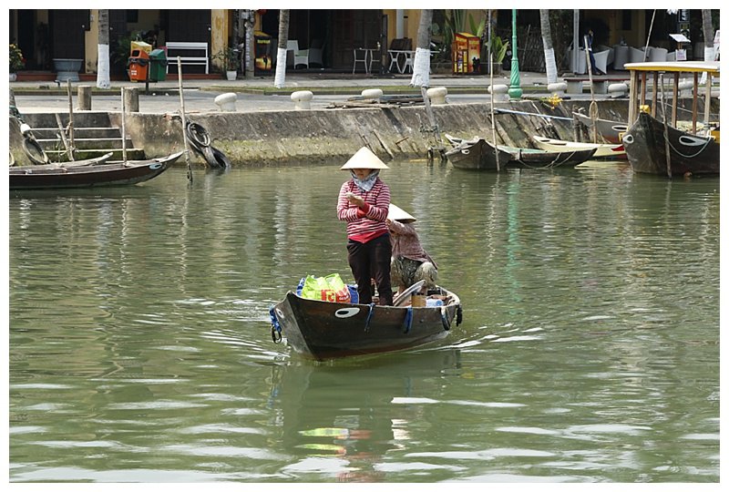 On the Bon River, a lady takes her shopping across