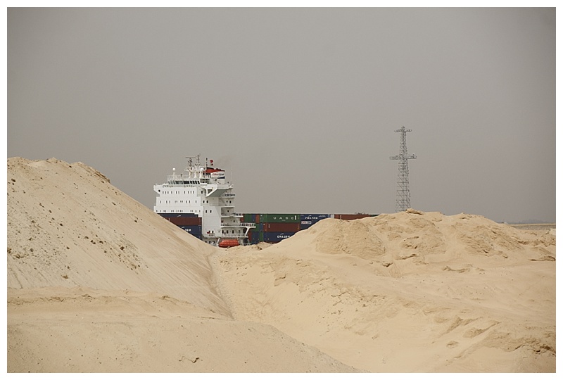 A southbound container-ship over the sand hills, the dredge from the new channel.