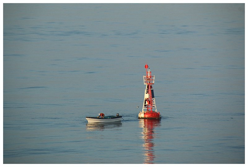 Even a buoy has its uses, a fisherman uses it as a mooring.